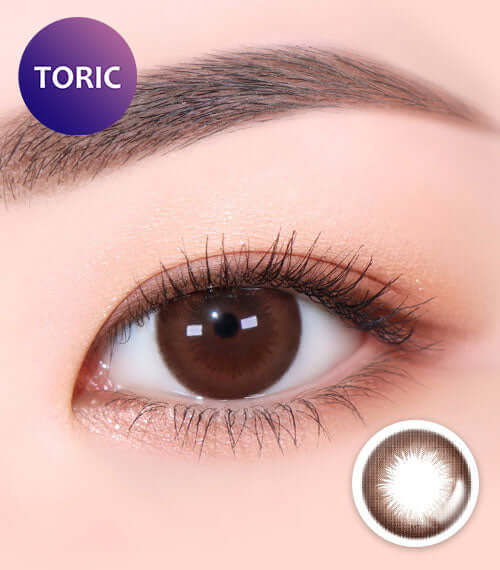Close-up of eye wearing Brownie Classic Brown TORIC contact lens for natural bigger look, choco color, water content 55%, ID K016CH.